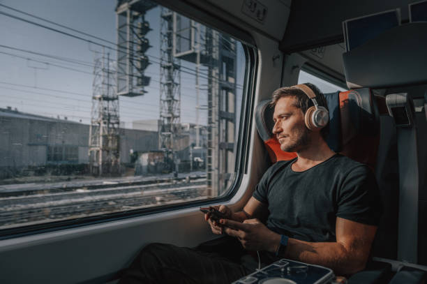 istock Young Man Traveling in Train 1371701491