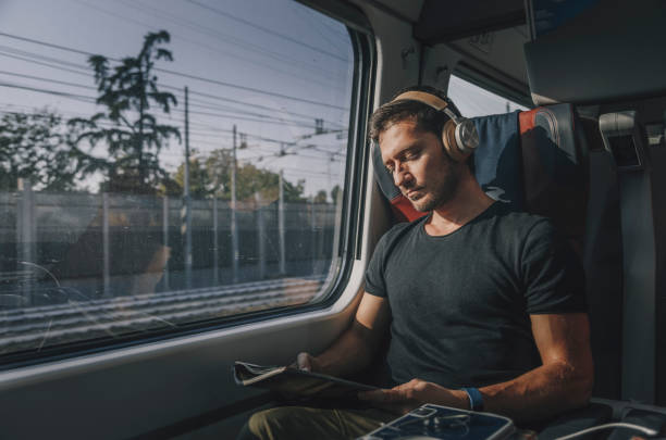 istock Young Man Traveling in Train 1371701780