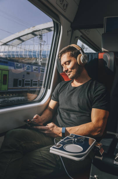 istock Young Man Traveling in Train 1371701983
