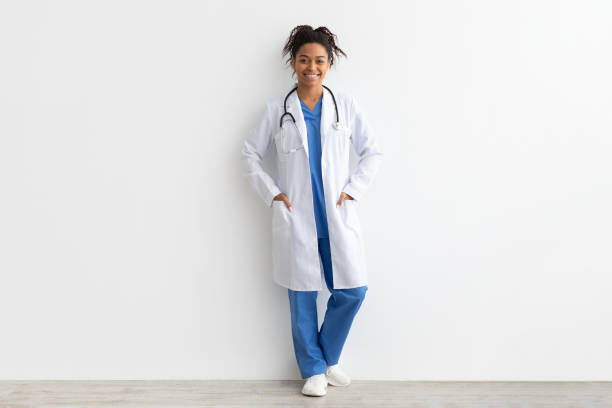 istock Portrait of black doctor posing with folded arms 1371702017