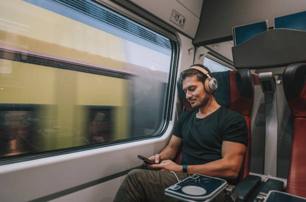 istock Young Man Traveling in Train 1371702938
