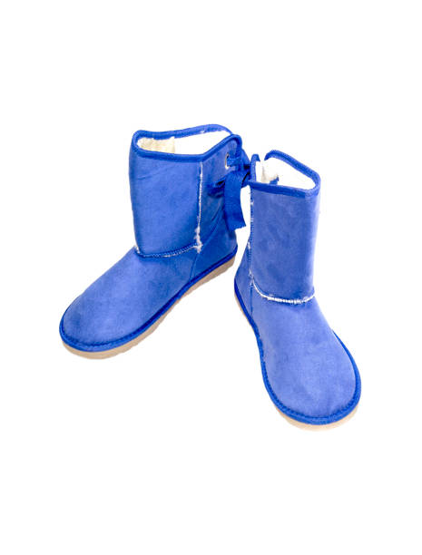 Footwear. Winter, women's blue boots on a white background close-up
