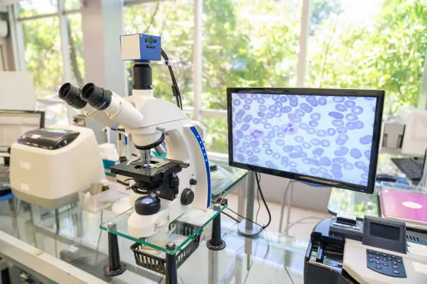 Photo of Modern microscope with digital imaging system in the lab