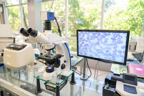 modern microscope with digital imaging system in the lab - technology research analyzing bacterium imagens e fotografias de stock