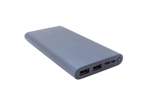 istock Power bank isolated on white background. External aluminum battery for charging various devices. 1371705246