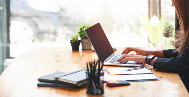 istock Creative businesswoman working on laptop computer at office. 1371706070