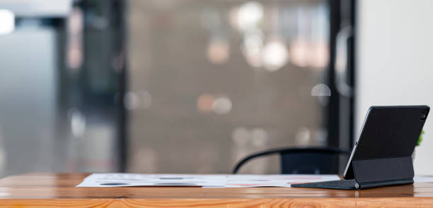 istock Modern home office mockup with digital tablet and magic keyboard on wooden table. Creative workspace. 1371706453