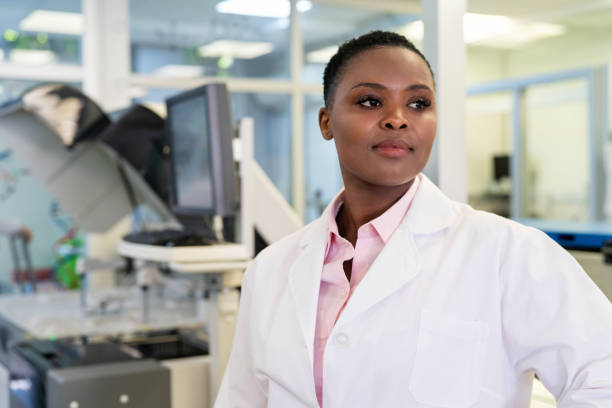istock Confident woman scientist looking away in lab 1371707453