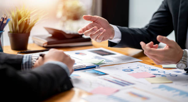 istock Businessman team working at office with document on his desk, doing planning analyzing the financial report, business plan investment, finance analysis concept. Economic business discussions. 1371708014
