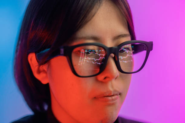 istock Woman checking chart for currency information on laptop. Cryptocurrency chart reflected on smart glasses. 1371709466