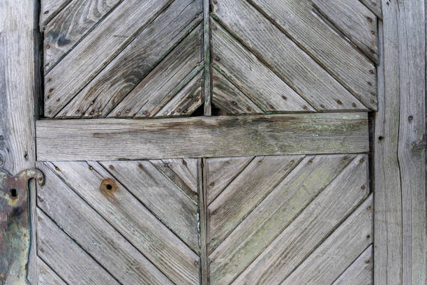 istock Elements of old wooden doors with diamond-shaped discs 1371710728