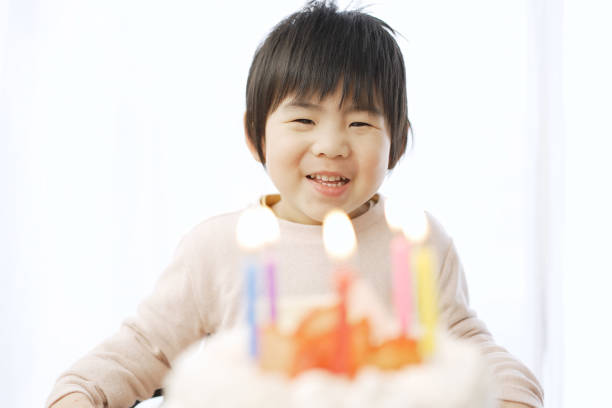 istock Asian boy happy with birthday cake 1371710861