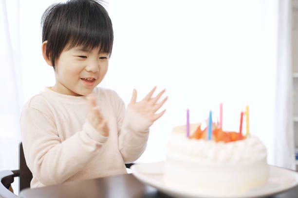 Asian boy happy with birthday cake