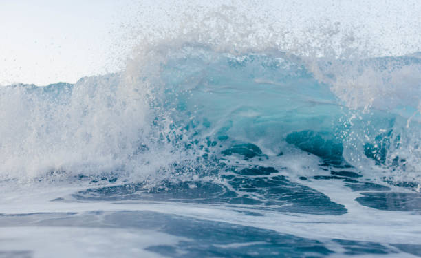 istock Small wave breaking in front of the camera 1371715225
