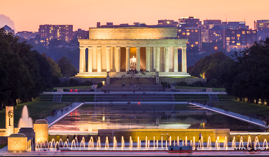 View of the iconic architecture of Washington DC in the USA with its neoclassic building and monuments at sunrise.