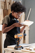 istock Little Boy Building in Workshop 1371721605