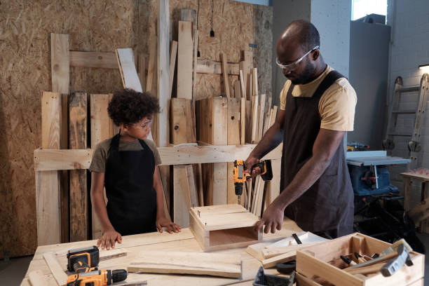 istock Father and Son Building Birdhouse 1371721610
