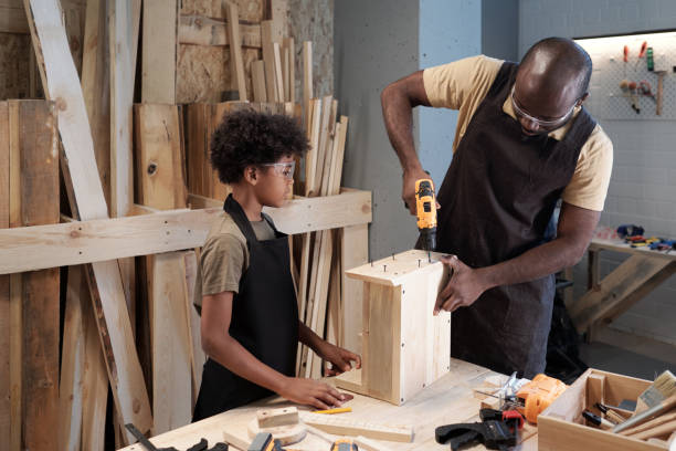 istock Father and Son building Birdhouse 1371721623
