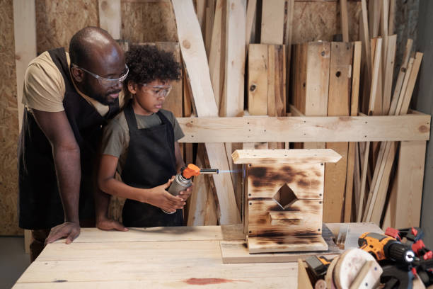 istock Father and Son Building Birdhouse 1371721637