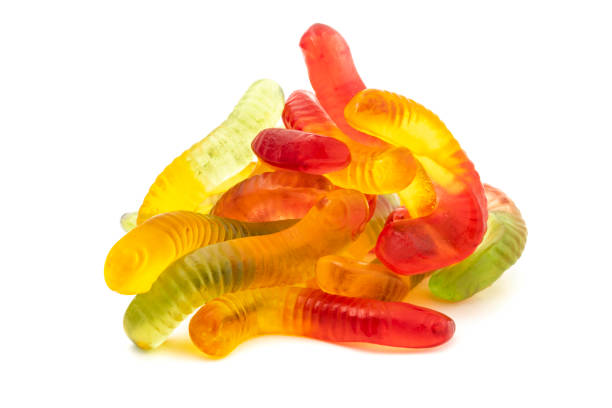istock Colorful Fruity Gummy Worm Candy isolated on white background. 1371721739