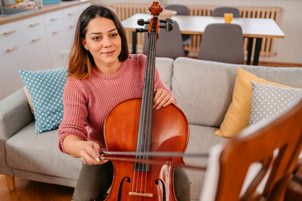 istock Young Musician Practicing Violoncello At Home 1371723248