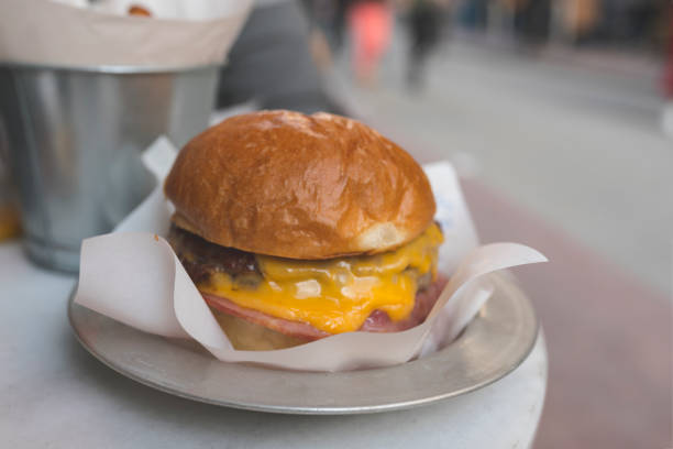 istock Hamburger with fluid cheddar cheese and bacon slice stock photo 1371725120