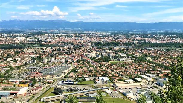 Aerial Panorama of Valence Drôme in France with Rhone River and Alps mountains in the background Aerial Panorama of Valence Drôme in France with Rhone River Valley and Alps mountains in the background on a beuatiful sunny sky valence drôme stock pictures, royalty-free photos & images