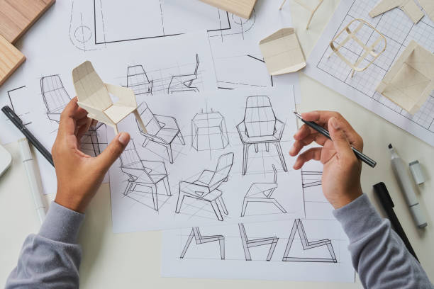 Designer sketching drawing design development product plan draft chair armchair Wingback Interior furniture prototype manufacturing production. designer studio concept . stock photo