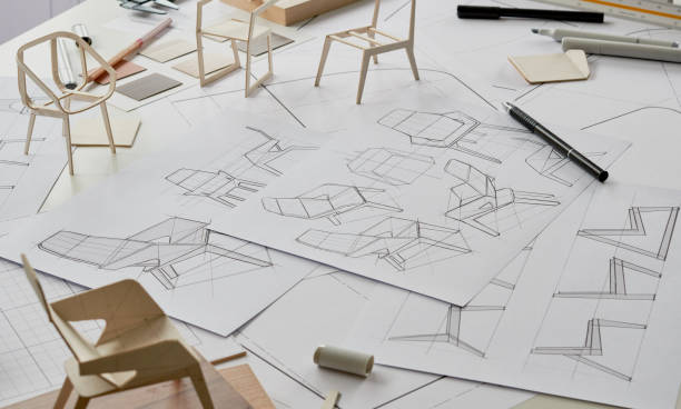 istock Designer sketching drawing design development product plan draft chair armchair Wingback Interior furniture prototype manufacturing production. designer studio concept . 1371726879
