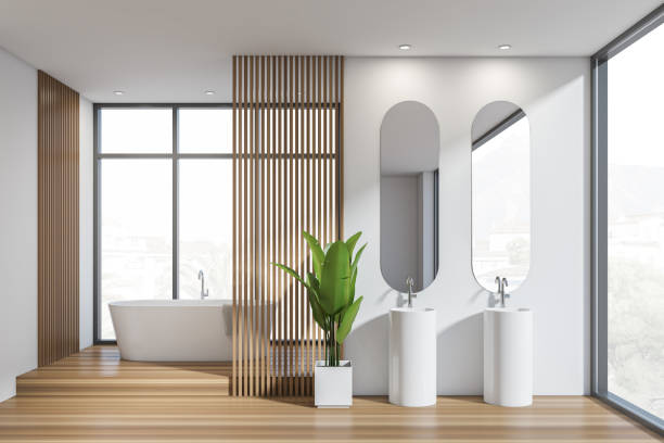 istock Bright bathroom interior with bathtub, panoramic window with town view 1371728191