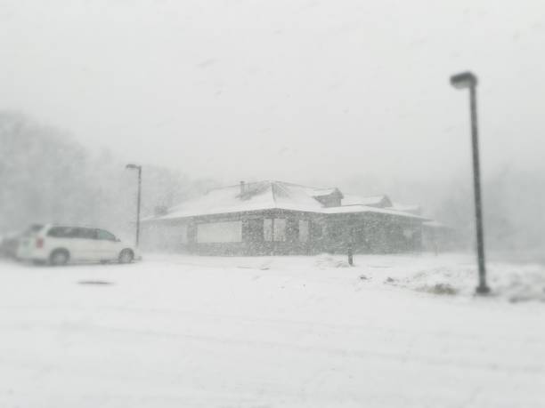 istock Building and Mini Van in a Snow Squall 1371728691