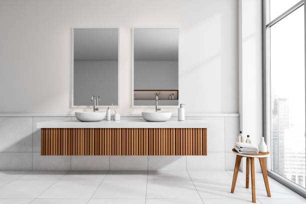 istock Bathroom interior with sink and mirror, accessories on table and window 1371729230
