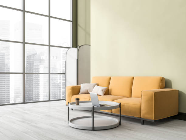 istock Relaxing room interior with sofa and coffee table with laptop, window. Mockup 1371730798