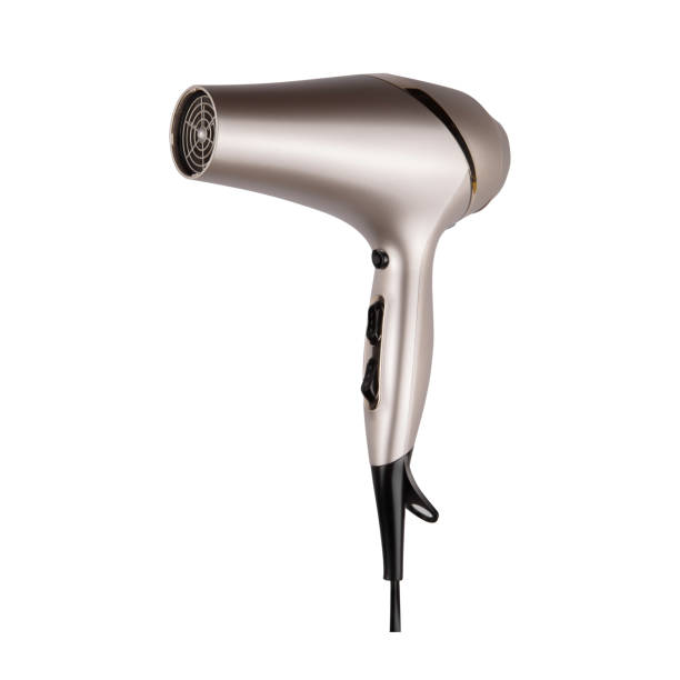 Golden hair dryer isolated on white background, copy space. Top view stock photo
