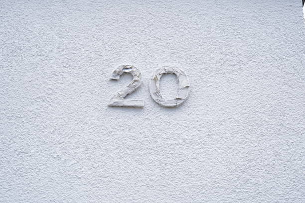 istock Freshly painted white wall with house number. 1371731365