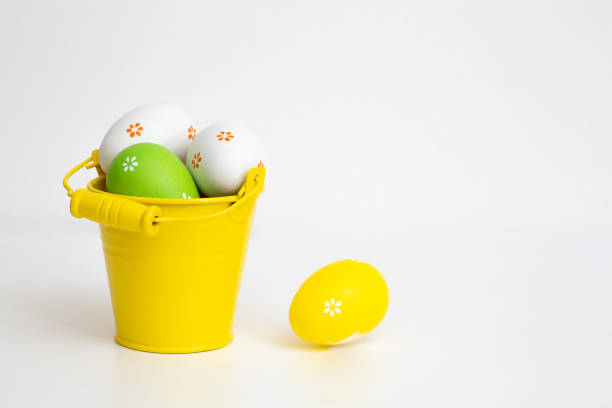istock Colorful easter eggs in bucket on white background. Easter background. 1371732855