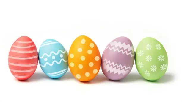 Multi-colored eggs on white background