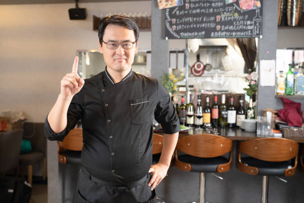 istock A man who runs a restaurant pointing to a point 1371735446