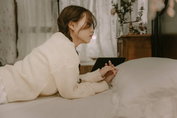 istock Asian girls resting in bed 1371736290