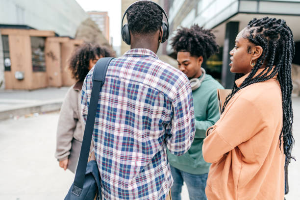 istock Group of students walking  outdoors 1371736355