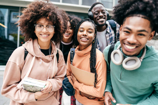istock Group of students walking  outdoors 1371736481