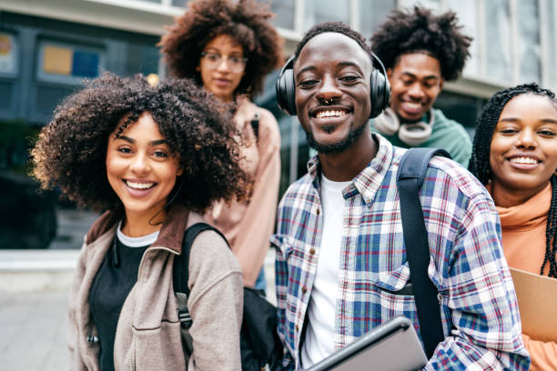 istock Group of students walking  outdoors 1371736482