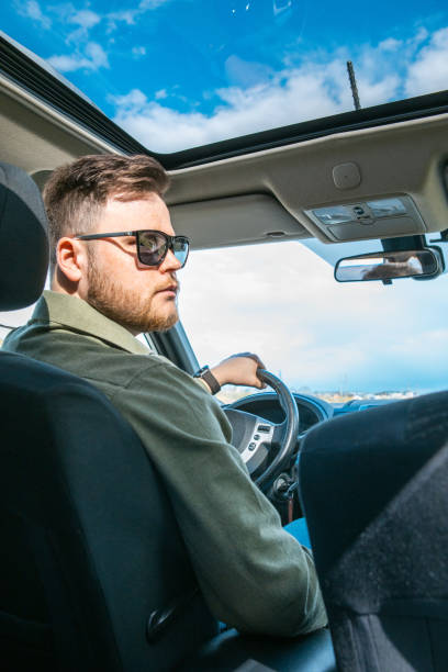 istock man portrait in car 1371736646