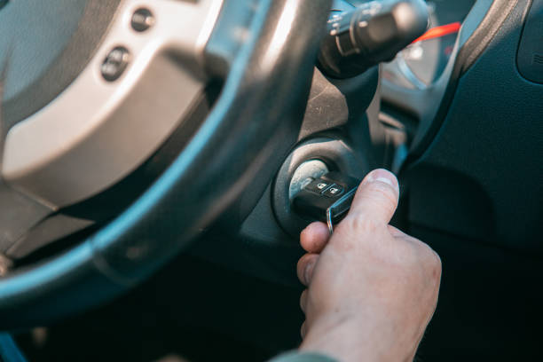 istock close up man hand put key to start car engine 1371736651