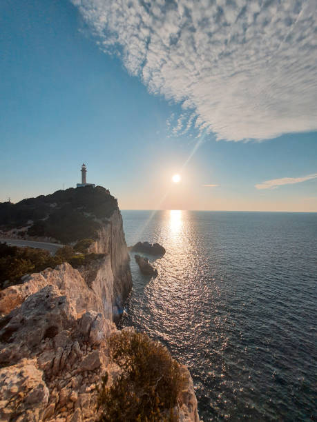 istock sunset above sea light house on the cliff 1371736678