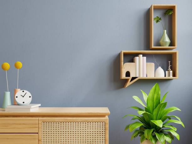 istock Interior wall mockup with green plant,dark blue wall and shelf. 1371741042