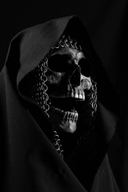 istock Skull with chainmail bonnet and black hood 1371741698