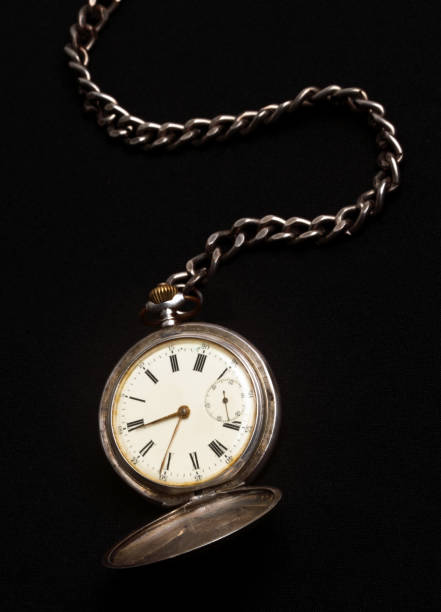 istock old pocket watch with black background 1371743054