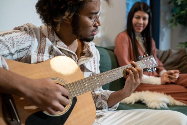 istock Man playing guitar and singing a song 1371743391
