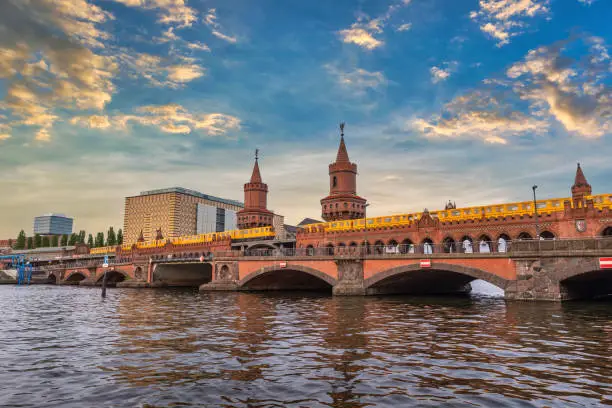 Berlin Germany, sunset city skyline at Oberbaum Bridge and Berlin Metro